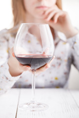 Young beautiful woman in depression, drinking alcohol