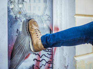 vandal man breaking the window and robbing the house