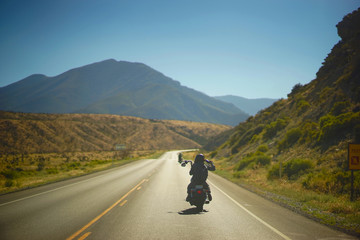 Motorcycles Through The Mountainside Valley - obrazy, fototapety, plakaty