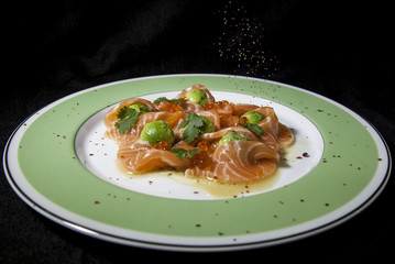 Kiev, Ukraine - February 26, 2018: Carpaccio with salmon and avocado.