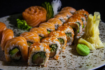  Kiev, Ukraine - February 26, 2018: Sashimi and rolls with salmon.