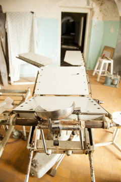 Old deserted hospital and operating table