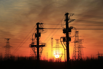 A high voltage substation in the sky at sunrise