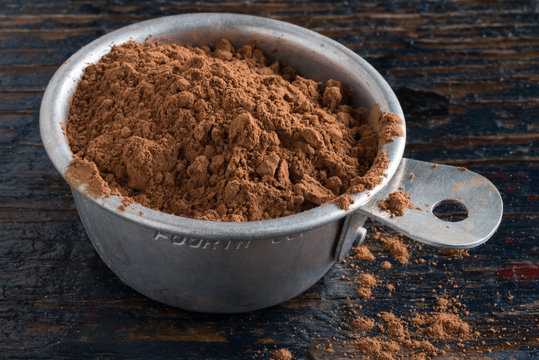 Unprocessed Cocoa Powder in a Measuring Cup