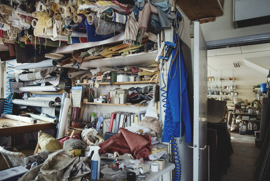 Various rolled up fabrics in workshop