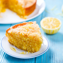 Cake with Lemon and Coconut.Homemade Cakes on a Blue Background.Copy space for Text. selective focus.