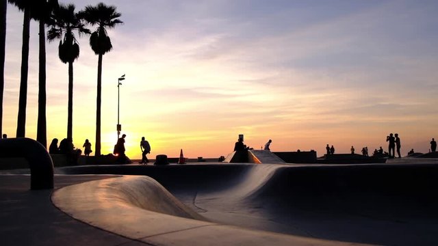 Skateboarding Venice Beach at Sunset, Southern California.