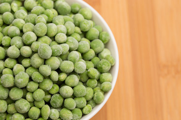 Frozen Peas on a Wooden Cutting Board