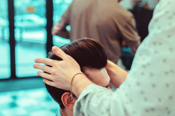 men's hair cutting scissors in a beauty salon