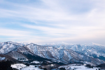 snowy mountains in the evening