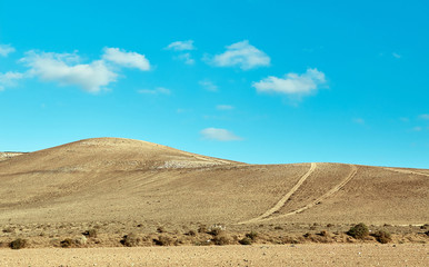 Volcanic hills and blue sky