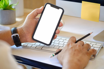 Close-up shot man using mobile phone. Blank screen for graphic display montage.