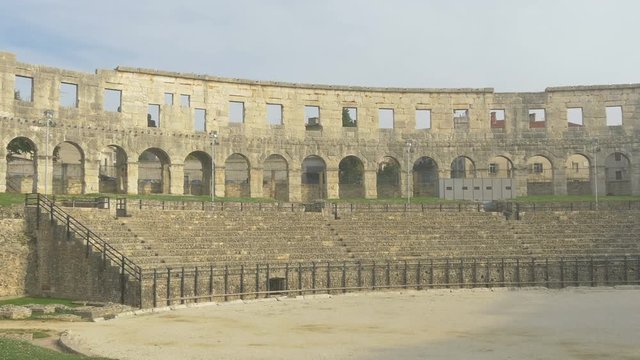 Roman amphitheater tribunes and stone wall