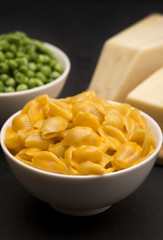 Macaroni Shells and Cheese on a Dark Slate Background