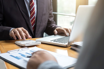 Co working conference, Business team meeting present, investor colleagues discussing new plan financial graph data on office table with laptop and calculator, Finance, accounting, investment
