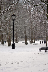 london, uk, 2nd march 2018 - Green Park covered in snow as comuters walk to work beast from the...