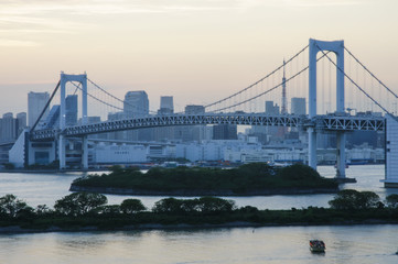Skyline View of Rainbow Bridge in Odaiba, Japan at Dusk