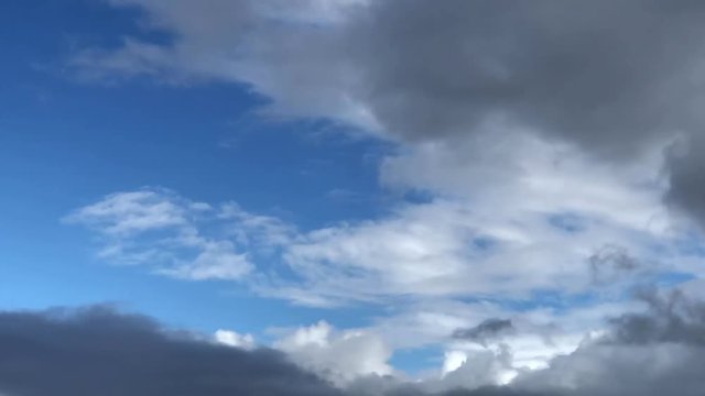 HD Video storm clouds rolling in covering sky previously clear blue in Northern California