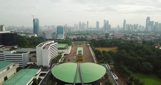 JAKARTA - Indonesia. February 28, 2018: Beautiful aerial landscape of DPR/MPR Building or Indonesia Parliament building with skyscrapers background. Shot in 4k resolution