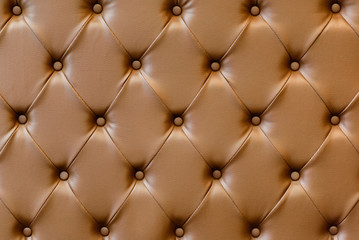 luxury buttoned brown leather background