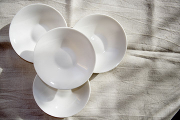 superimposed white small saucer