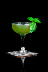 alcoholic drink with fresh mint on a black background