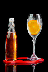alcoholic drink in a bottle on a black background