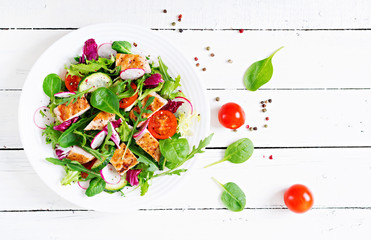 Fresh vegetable salad with grilled chicken breast   - tomatoes, cucumbers, radish and mix lettuce...