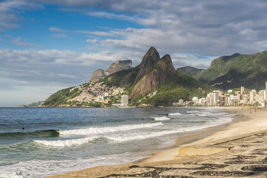 Famous Ipanema Beach with Dois Irmaos Mountains. Early morning light. Rio de Janeiro, Brazil