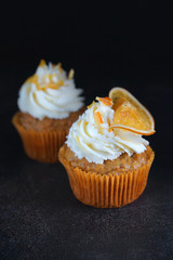 Carrot cupcake on minimalistic black background, Handmade pastry, Copy Space, Close up