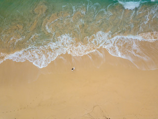 Fototapeta na wymiar Girl Twirling on Kekaha Beach Kauai