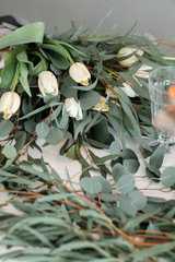 White tulips and eucalyptus. Delicate spring bouquet with green leaves