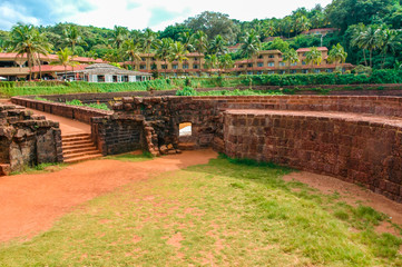 Fototapeta na wymiar Aguada Fort. Ancient fortress on the shores of the Indian ocean. Goa. India. Vacation holidays travel background wallpaper