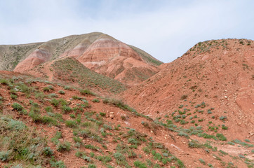 red sandstone outcrops on the slopes of Big Bogdo sacred mountain in Caspian steppe Bogdo-Baskunchak nature reserve, Astrakhan region, Russia