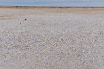 sand mixed with salt at the deserted old mining site  Lake Baskunchak, Astrakhan region, Russia