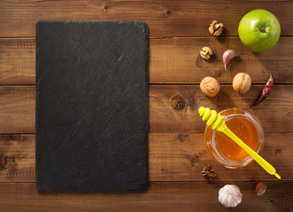 glass jar of honey on wood