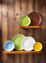 plate at kitchen wooden shelf at wall