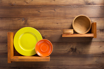 plate at kitchen wooden shelf at wall