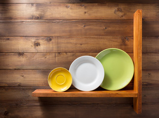 plate at kitchen wooden shelf at wall
