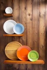 plate at kitchen wooden shelf at wall