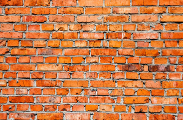 Old weathered grunge red brick wall as background texture