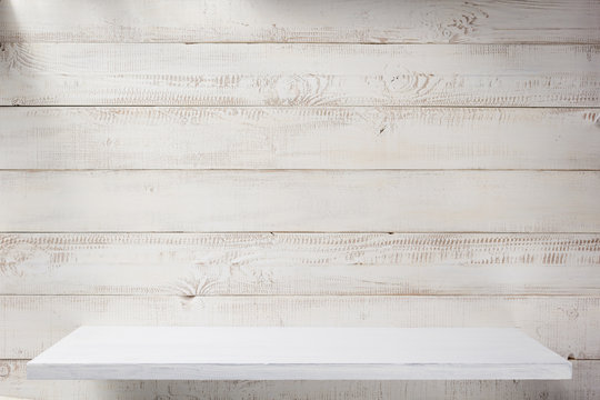 shelf at white plank wooden background