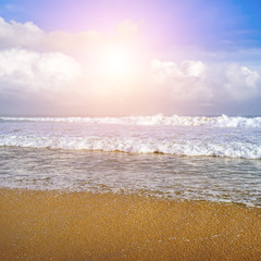 Beautiful seascape and sun on blue sky .