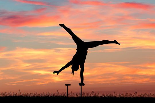 girl acrobat at sunset