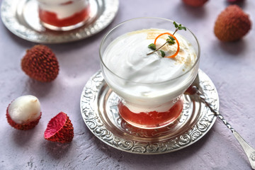 Lychee dessert with grapefruit on pink background