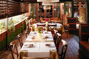 Setting tables in retro designed restaurant