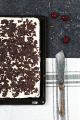 Homemade Black forest sheet cake with rustic silver knife. Top view. Copy space. 