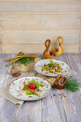 salads in a composition on a wooden background