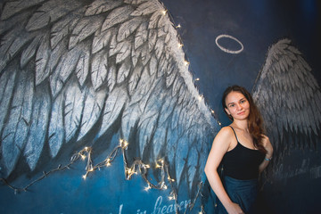 Girl with graffiti angel wings