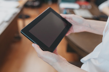 Detail of an intern looking at notepad